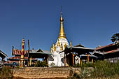 Inle Lake Myanmar. All the buildings are constructed on piles. Residents travel around by canoe, but there are also bamboo walkways and bridges over the canals, monasteries and stupas. 